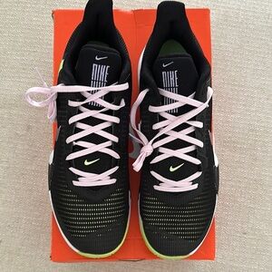 Nike Black and Pink Athletic Shoes with Low-Top Design